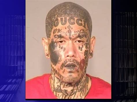 gucci face tattoo fresno|Gang member with face emblazoned with Gucci tattoo .